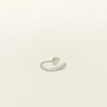 Image of the Thin Band Ear Cuff offers Medium Secure hold for up to 24 hours of comfortable wear. This ear cuff can be adjusted slightly once on the ear, and is ideal for all ear types, including thick/large ears, sensitive ears, small/thin ears, and stretched/healing ears. It is crafted from gold or silver plated copper alloy, with Cubic Zirconia for sparkle. This one-piece ear cuff also doubles as a faux nose piercing.