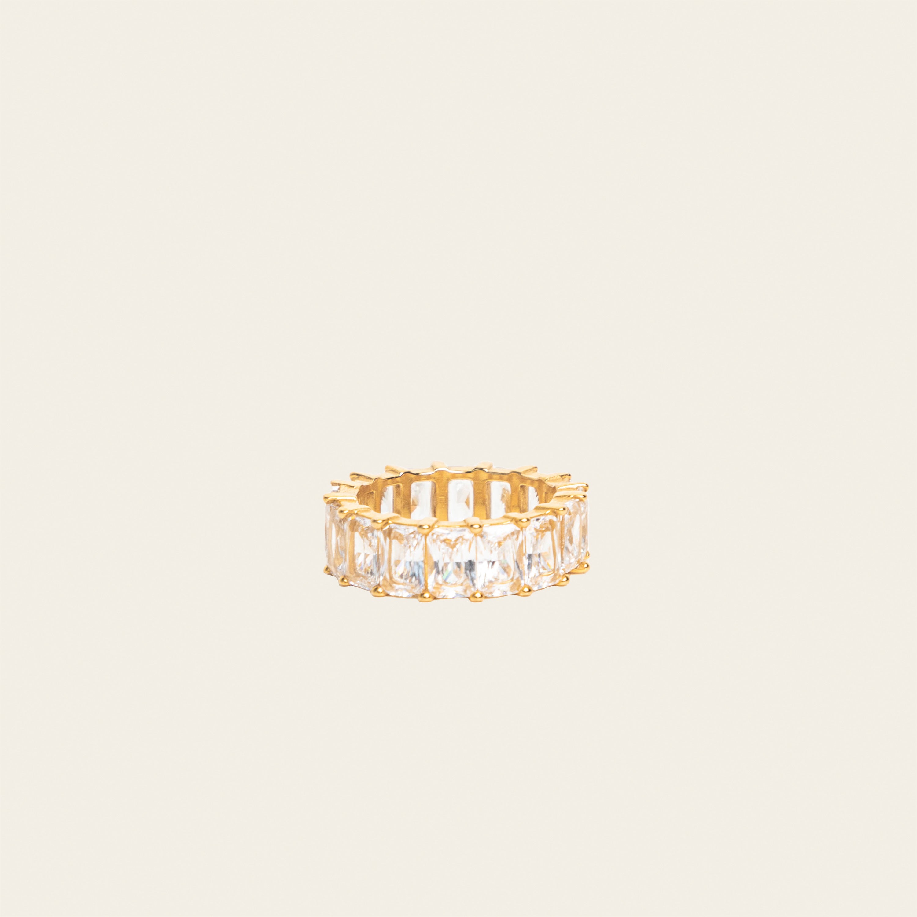 Image of the Jamie Ring boasts 18K gold plating over durable stainless steel for unrivaled resistance to tarnishing and water damage. Its sleek and timeless appeal is heightened by the non-adjustable design, making it the perfect single ring for any occasion.
