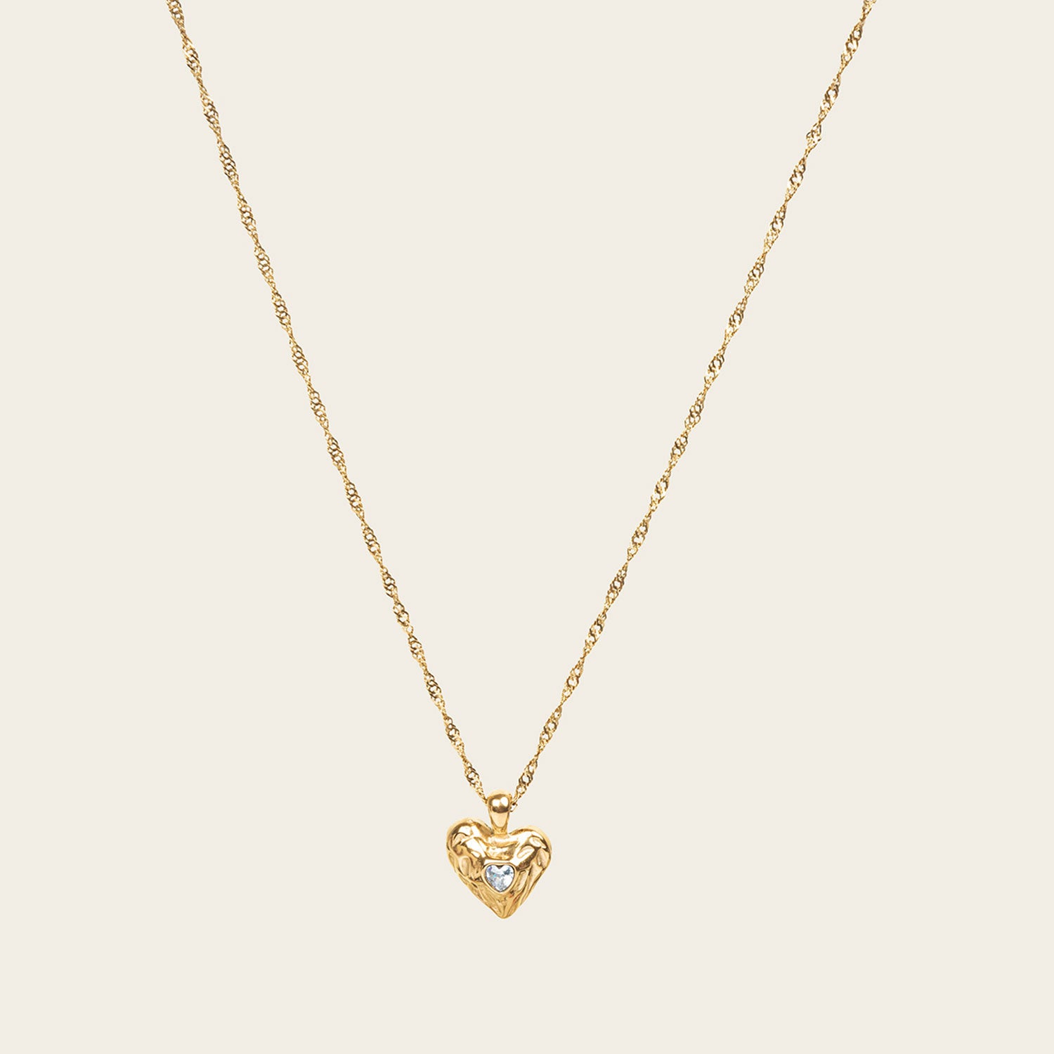 Image of the Textured Heart Pendant Necklace is crafted from 14K Gold Plated Stainless Steel with a Cubic Zirconia stone, and is non-tarnish, water resistant, and free from Lead, Nickel, and Cadmium. It is also adjustable and has only one necklace included.