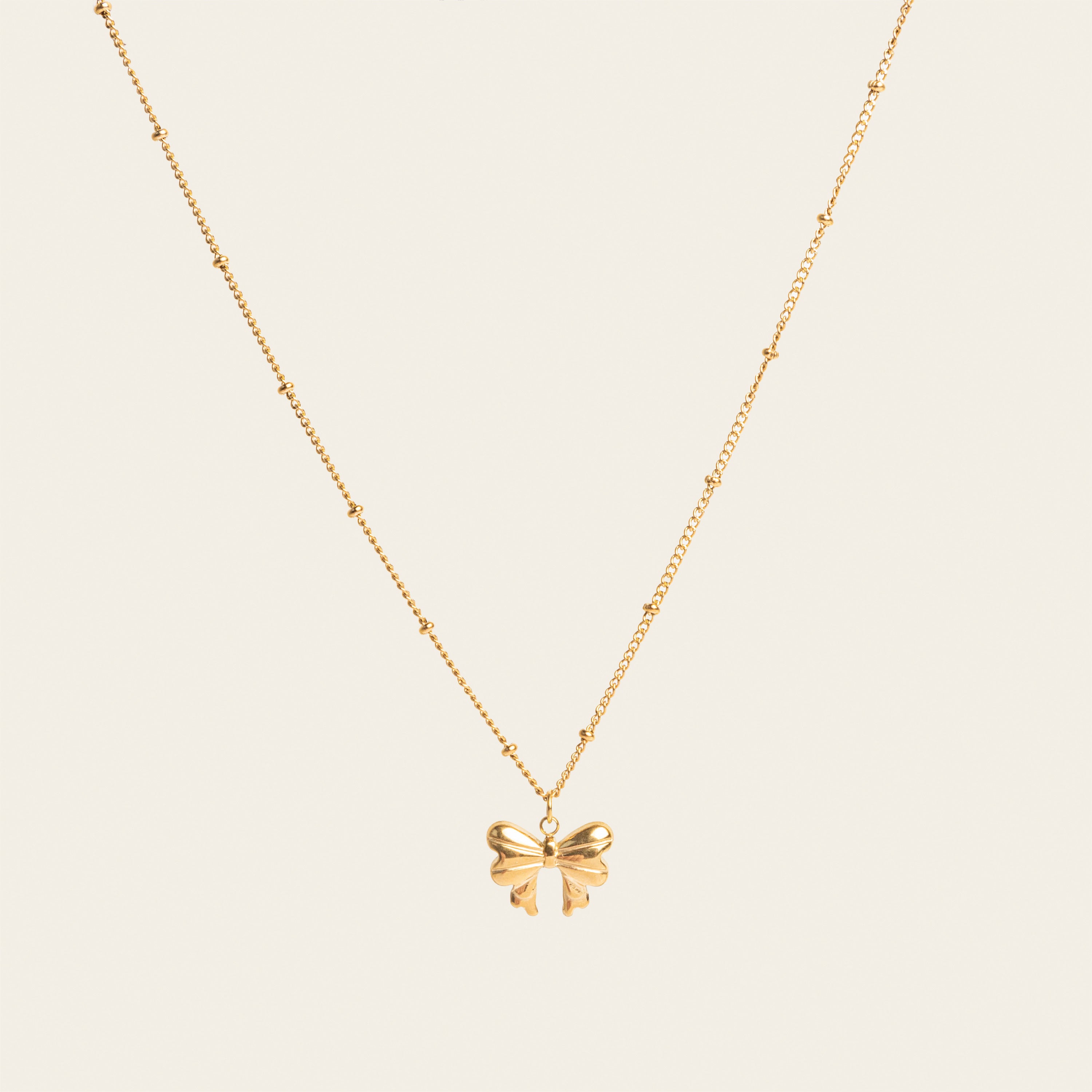 Image of the Wendy Necklace - the perfect combination of style and durability. This versatile accessory, made from non-tarnish 18K gold-plated stainless steel, is water-resistant and suitable for any occasion. With its adjustable design, it's the only necklace you'll ever need. 