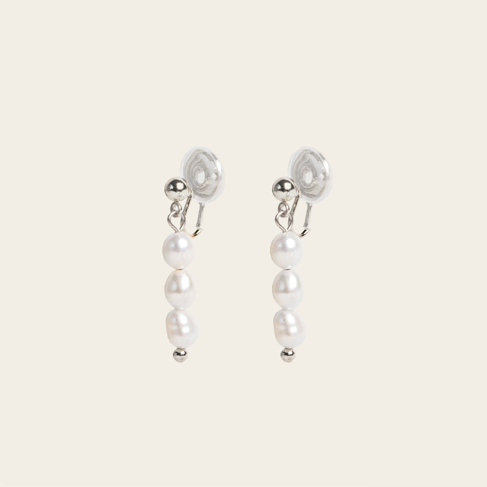 Image of the Audrey Clip On Earrings. These elegant earrings are adjustable for any ear type and provide a secure and comfortable hold for up to 24 hours. Perfect for sensitive or stretched ears, add a touch of sophistication to your daily style.