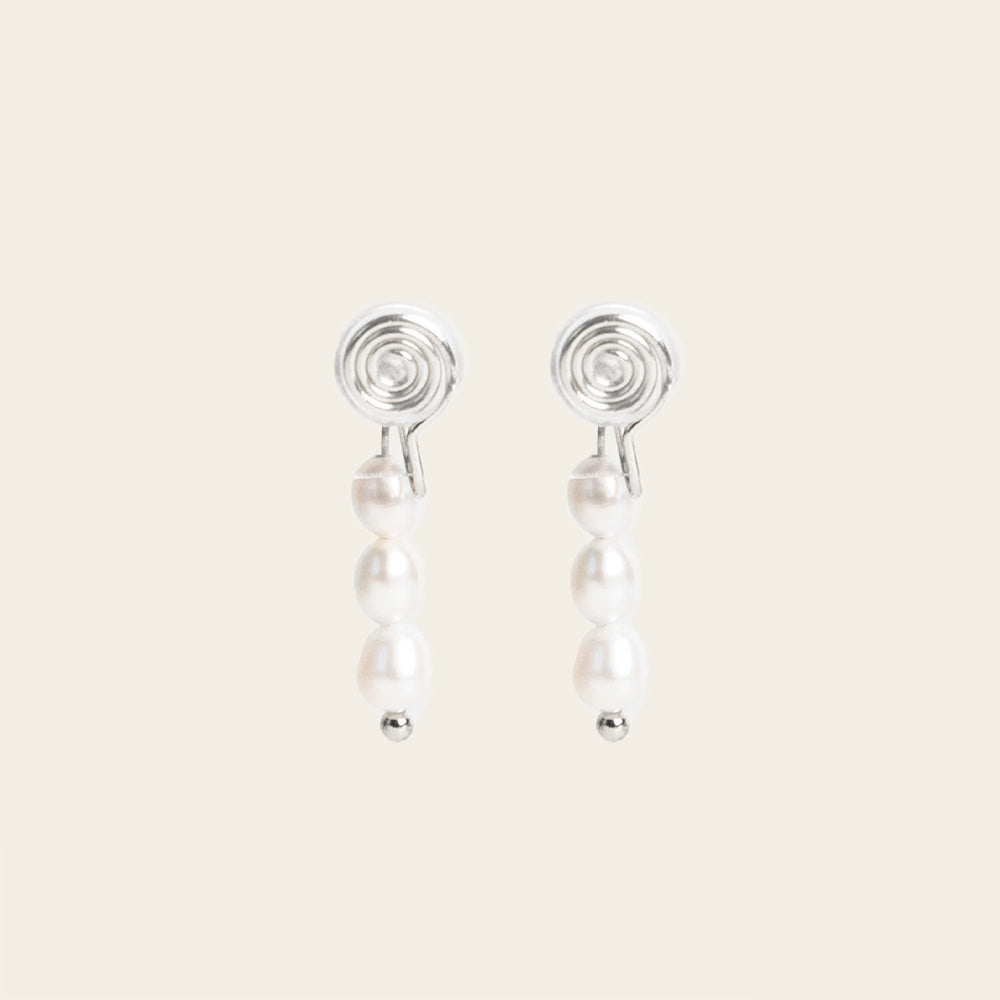 Image of the Audrey Clip On Earrings. These elegant earrings are adjustable for any ear type and provide a secure and comfortable hold for up to 24 hours. Perfect for sensitive or stretched ears, add a touch of sophistication to your daily style.