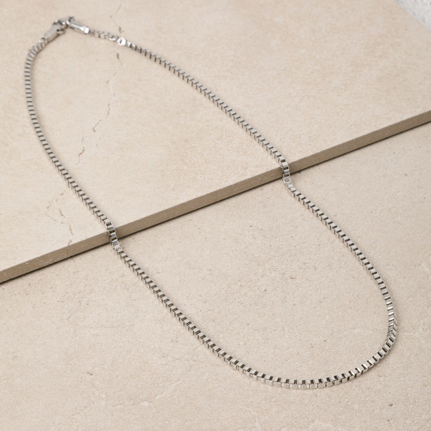 Image of the 3.5mm Square Box Chain crafted from high-grade Stainless Steel, measuring 22 inches / 56 cm in length and 2 mm in width. Weighing 5.8 grams, this chain is non-tarnishing and water-resistant.