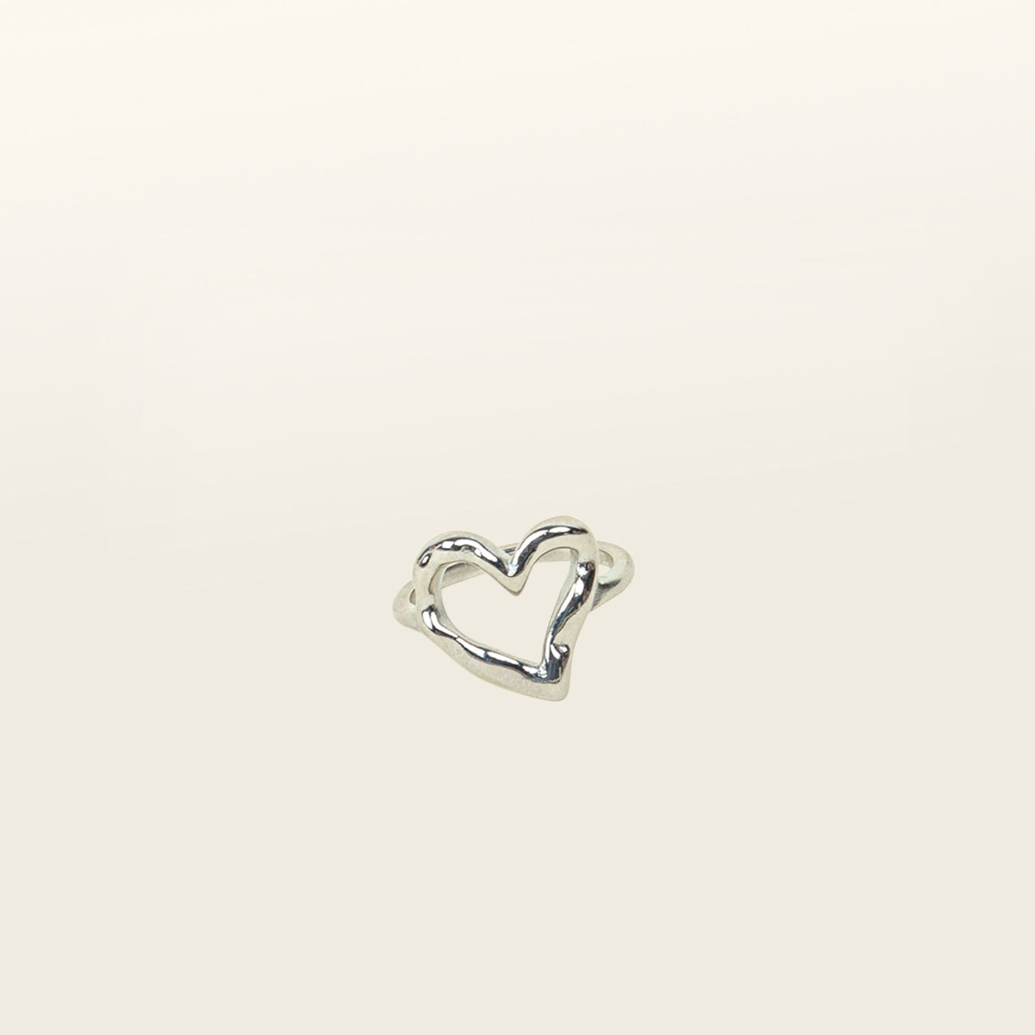 Image of the Ai Heart Ring in Silver is crafted with of 14K Gold Plated Stainless Steel, ensuring a durable and non-tarnishing construction. This piece is also water resistant and made without Lead, Nickel, or Cadmium for added safety. This is a single ring, with no ability to adjust.