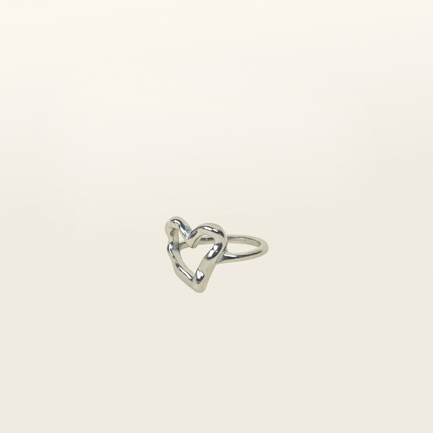Image of the Ai Heart Ring in Silver is crafted with of 14K Gold Plated Stainless Steel, ensuring a durable and non-tarnishing construction. This piece is also water resistant and made without Lead, Nickel, or Cadmium for added safety. This is a single ring, with no ability to adjust.