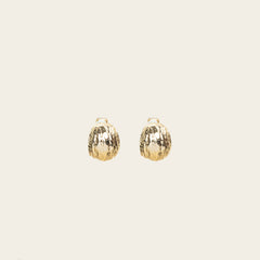 Image of the Alaia Clip On Earrings in Gold feature a padded clip-on closure, offering secure hold and ideal comfort for 8-12 hours of wear, for ear types of all shapes and sizes. Crafted from gold tone copper alloy, these earrings feature a single pair per item.