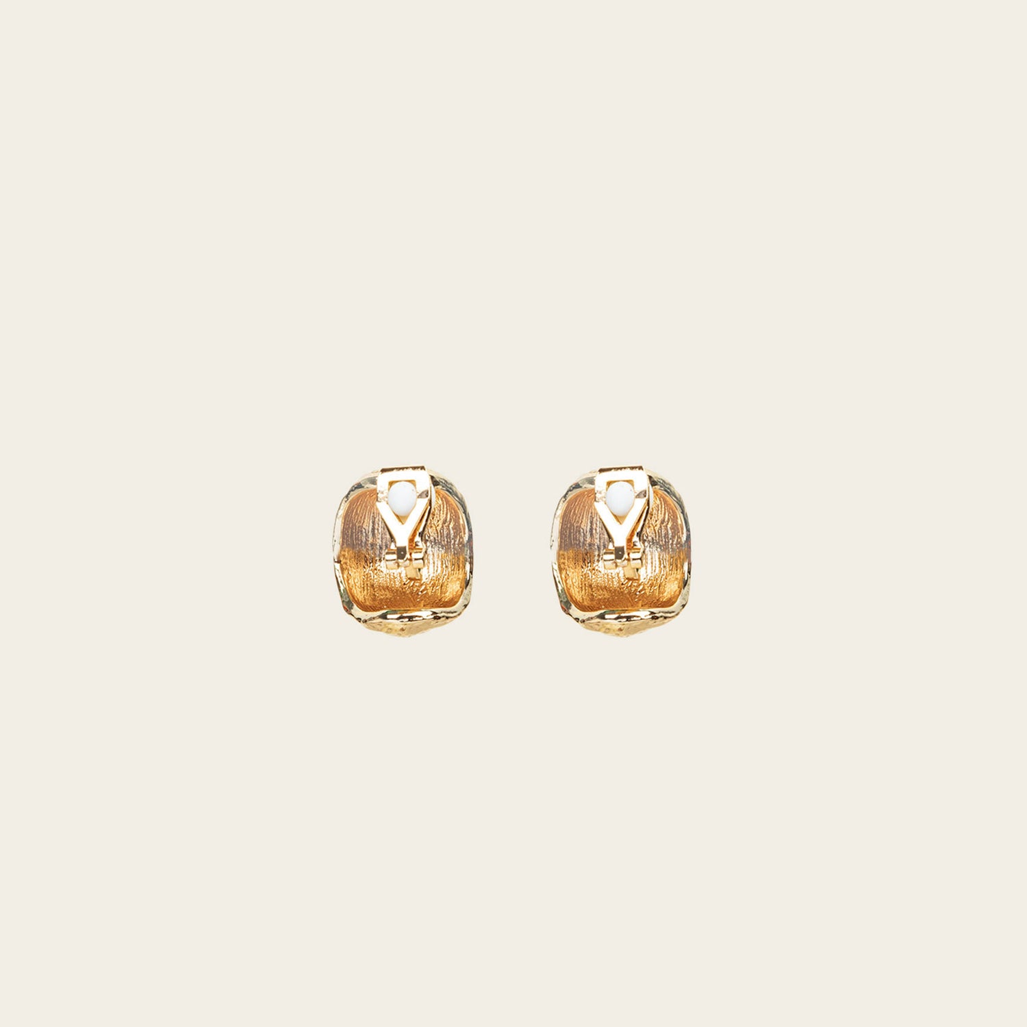 Image of the Alaia Clip On Earrings in Gold feature a padded clip-on closure, offering secure hold and ideal comfort for 8-12 hours of wear, for ear types of all shapes and sizes. Crafted from gold tone copper alloy, these earrings feature a single pair per item.