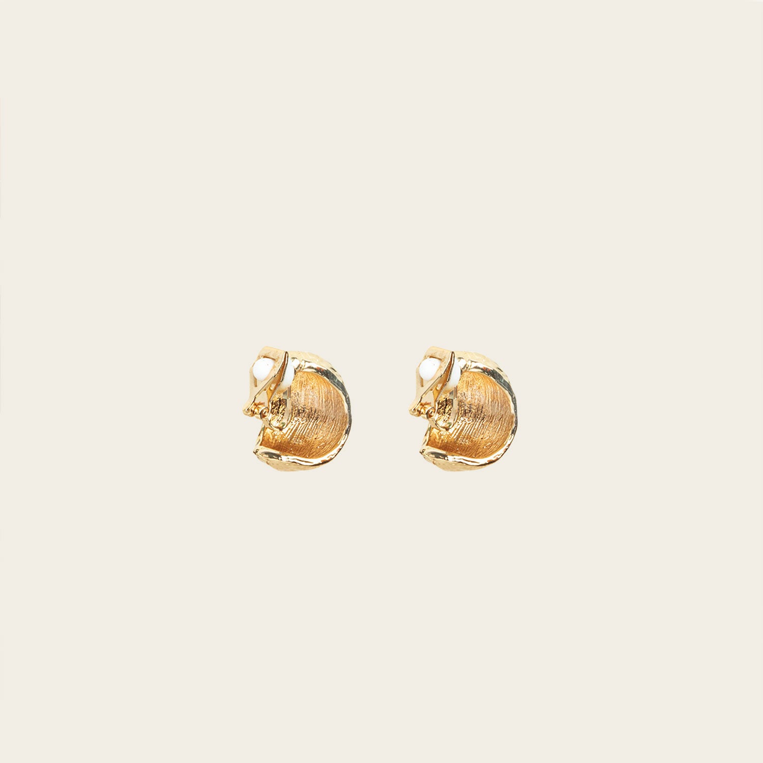 Image of the Alaia Clip On Earrings in Gold feature a padded clip-on closure, offering secure hold and ideal comfort for 8-12 hours of wear, for ear types of all shapes and sizes. Crafted from gold tone copper alloy, these earrings feature a single pair per item.