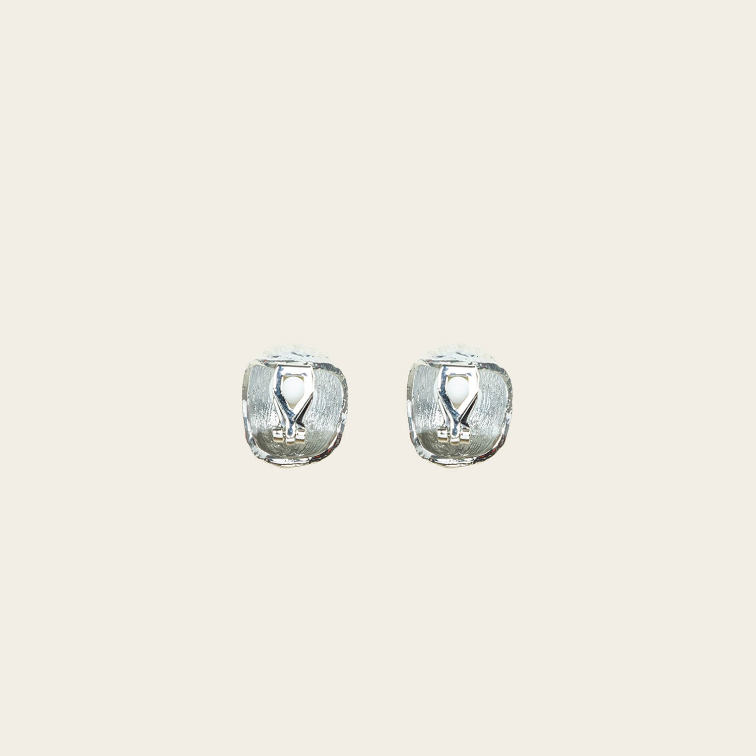 Image of the Alaia Clip On Earrings in Silver feature a padded clip-on closure, offering secure hold and ideal comfort for 8-12 hours of wear, for ear types of all shapes and sizes. Crafted from gold tone copper alloy, these earrings feature a single pair per item.