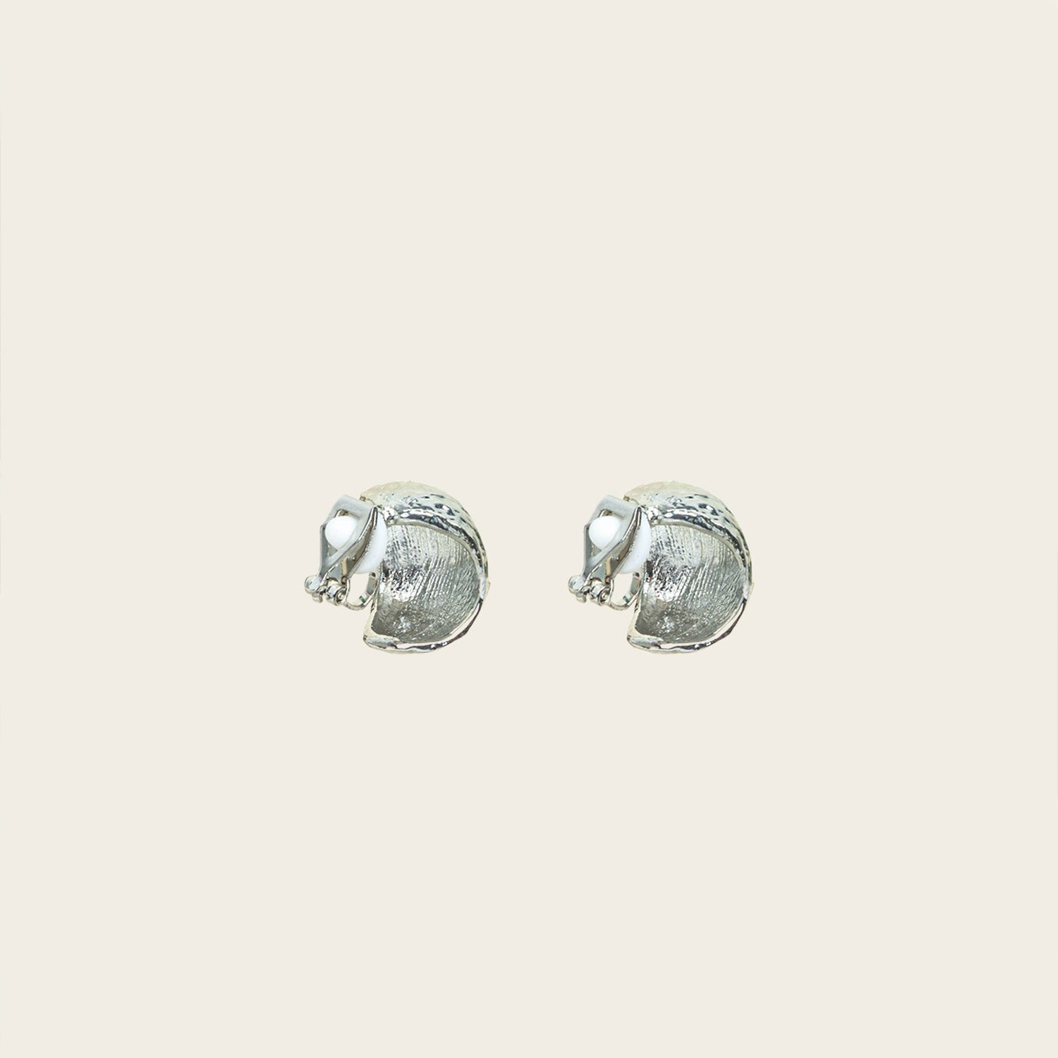 Image of the Alaia Clip On Earrings in Silver feature a padded clip-on closure, offering secure hold and ideal comfort for 8-12 hours of wear, for ear types of all shapes and sizes. Crafted from gold tone copper alloy, these earrings feature a single pair per item.