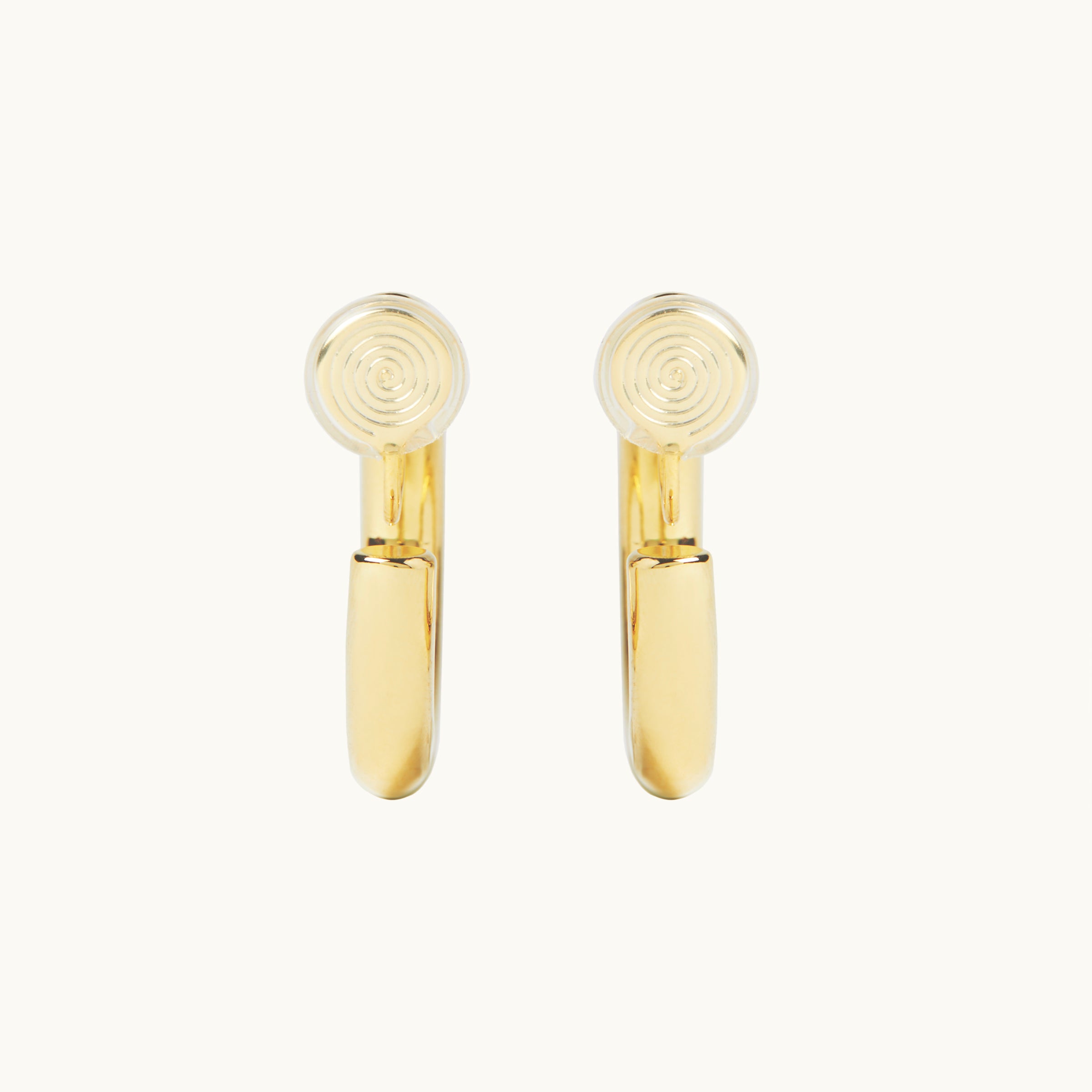 Image of the Allie Hoop Clip On Earrings in Gold, which are perfect for all ear types. The Mosquito Coil Clip-On Closure is suitable for Thick/Large, Sensitive, Small/Thin, Stretched/Healing, and Keloid Prone Ears. Made of a Gold tone copper alloy, each purchase includes one pair.