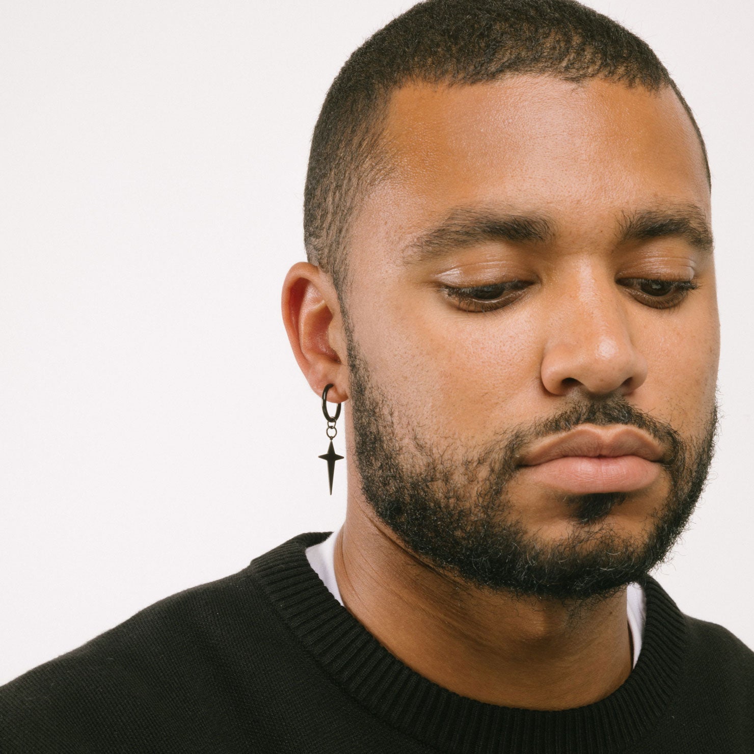 A model wearing the Altair Clip On Earrings offer a secure and adjustable closure that are perfect for those with thin ear lobes. Crafted with stainless steel and featuring non-tarnish and water-resistant properties, these earrings are hypoallergenic, lead and nickel free. The average comfortable wear duration is 2 to 4 hours. The item is sold as one pair.