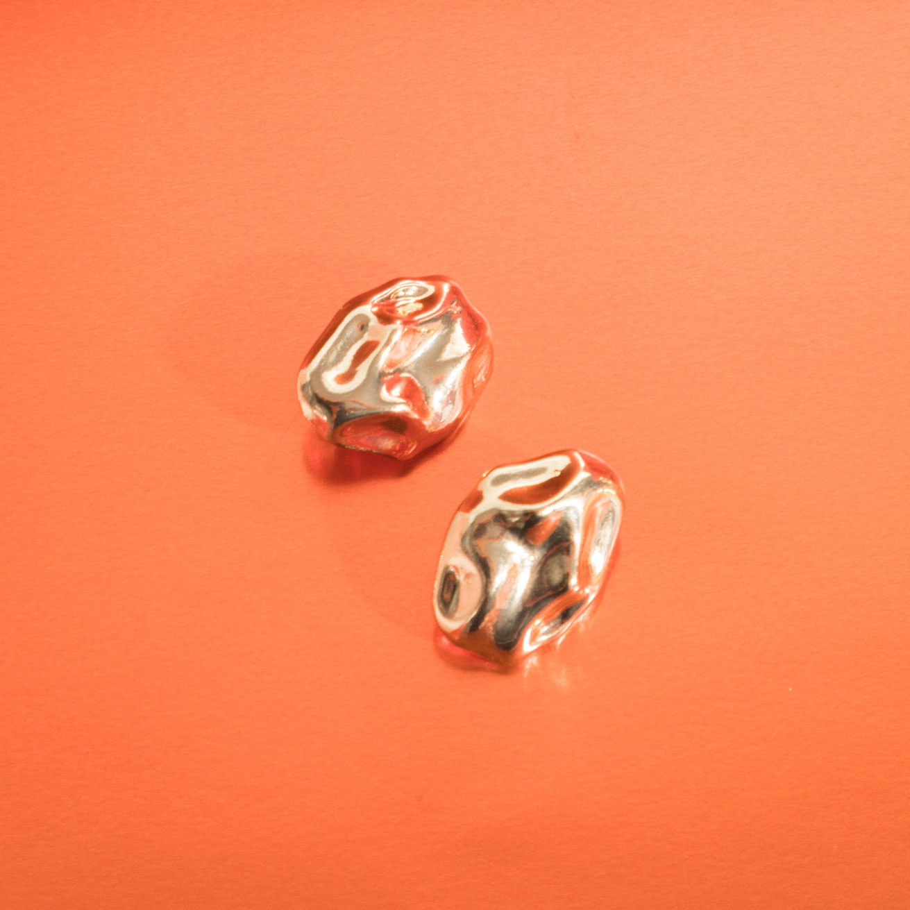 Image of the Amaya Clip On Earrings in Gold feature a secure padded clip-on closure type, making them suitable for all ear types.The average comfortable wear duration is 8-12 hours, and the Copper Alloy construction ensures a reliable and secure hold. The item is sold as one pair; adjustable rubber padding is included.