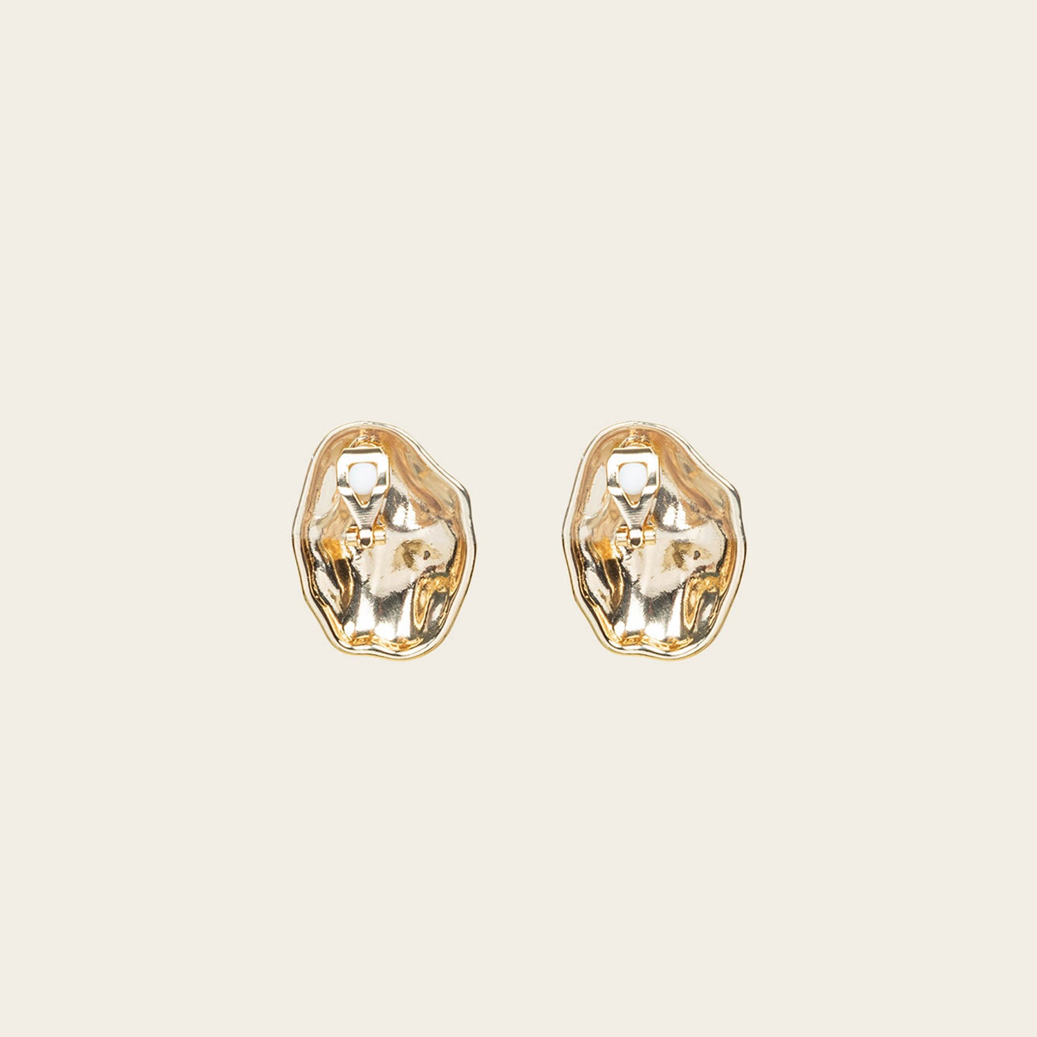 Image of the Amaya Clip On Earrings in Gold feature a secure padded clip-on closure type, making them suitable for all ear types.The average comfortable wear duration is 8-12 hours, and the Copper Alloy construction ensures a reliable and secure hold. The item is sold as one pair; adjustable rubber padding is included.