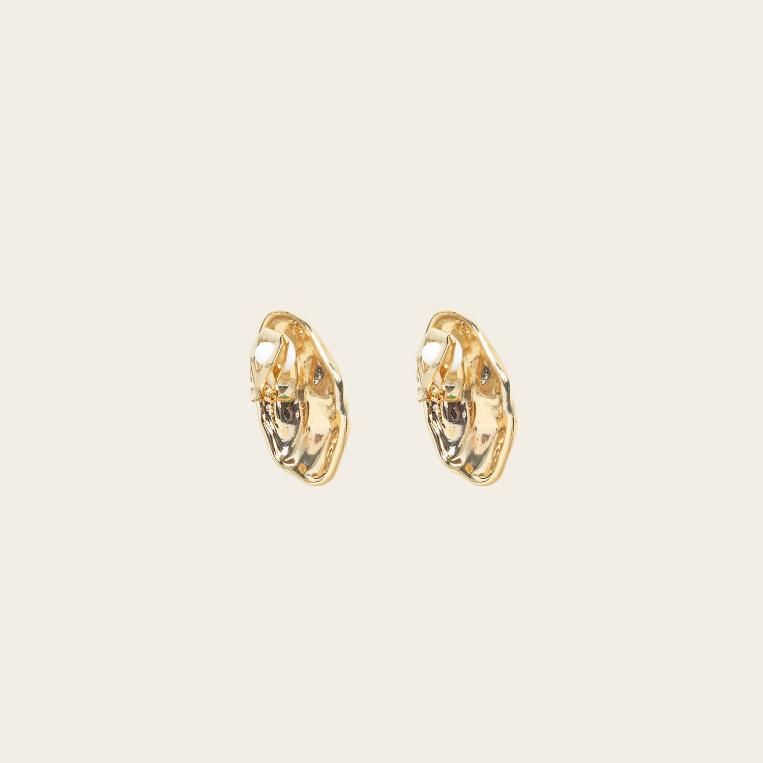 Image of the Amaya Clip On Earrings in Gold feature a secure padded clip-on closure type, making them suitable for all ear types.The average comfortable wear duration is 8-12 hours, and the Copper Alloy construction ensures a reliable and secure hold. The item is sold as one pair; adjustable rubber padding is included.