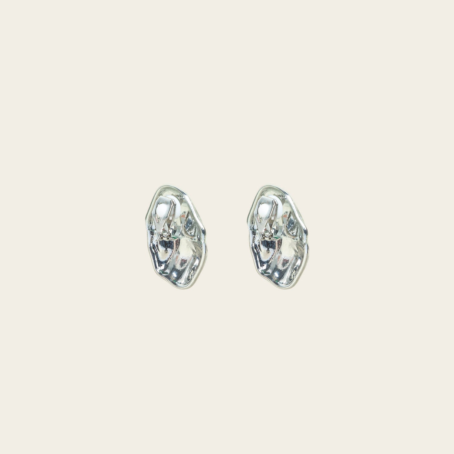 Image of the Amaya Clip On Earrings in Silver feature a secure padded clip-on closure type, making them suitable for all ear types.The average comfortable wear duration is 8-12 hours, and the Copper Alloy construction ensures a reliable and secure hold. The item is sold as one pair; adjustable rubber padding is included.