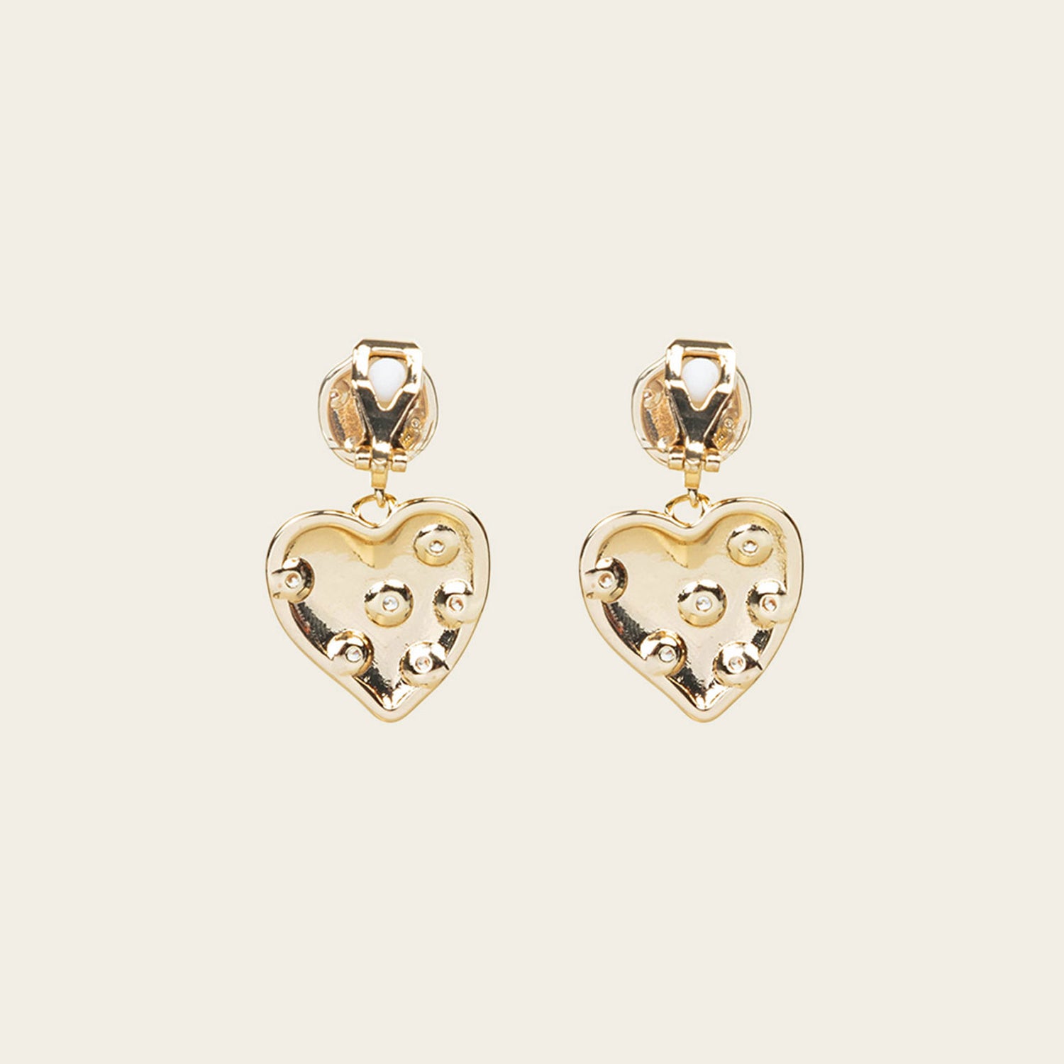 Image of the Amore Clip On Earrings in Gold offer a secure, padded closure type for a comfortable wear of 8-12 hours that is suitable for all ear types. This single pair features stainless steel and cubic zirconia construction and is non-tarnish and water resistant. Note: The clip-on earring has removable rubber padding.