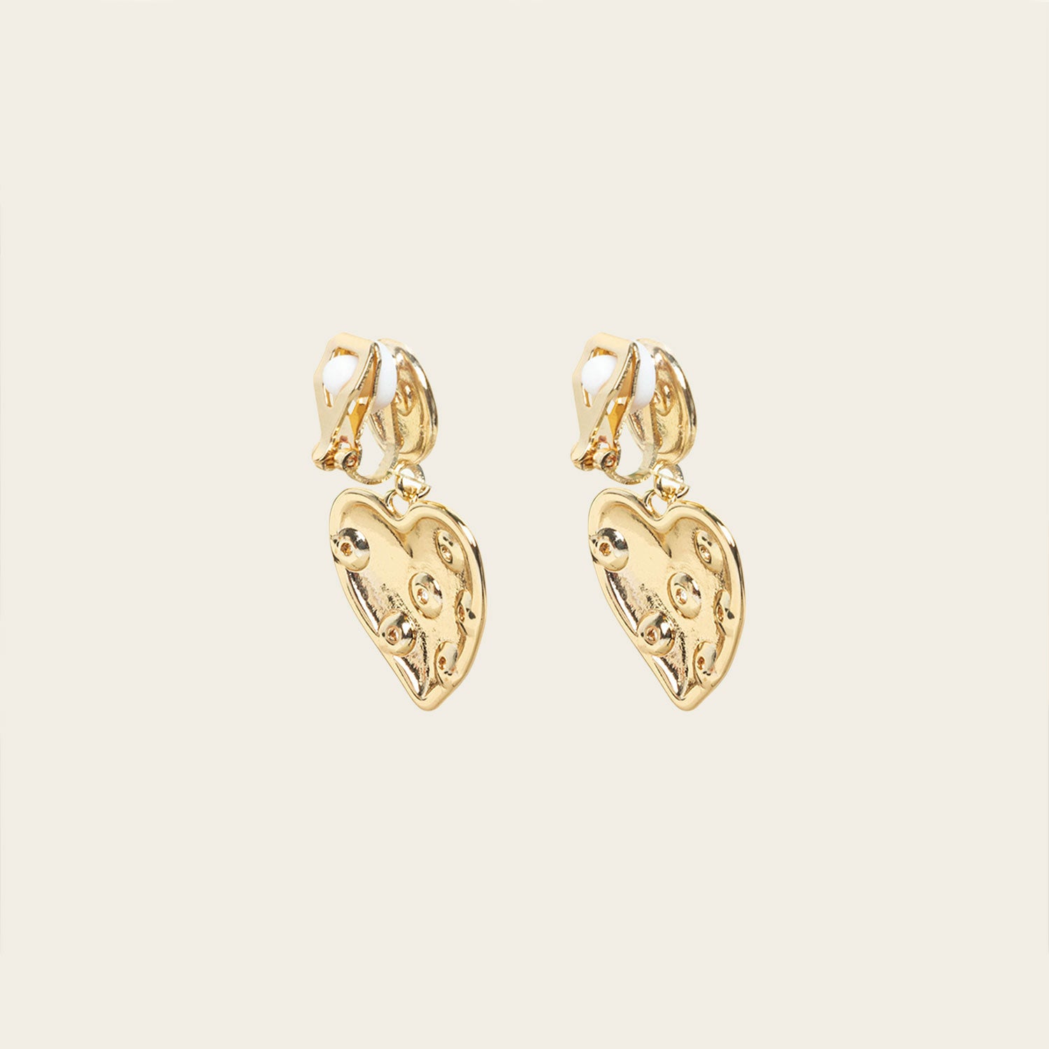 Image of the Amore Clip On Earrings in Gold offer a secure, padded closure type for a comfortable wear of 8-12 hours that is suitable for all ear types. This single pair features stainless steel and cubic zirconia construction and is non-tarnish and water resistant. Note: The clip-on earring has removable rubber padding.