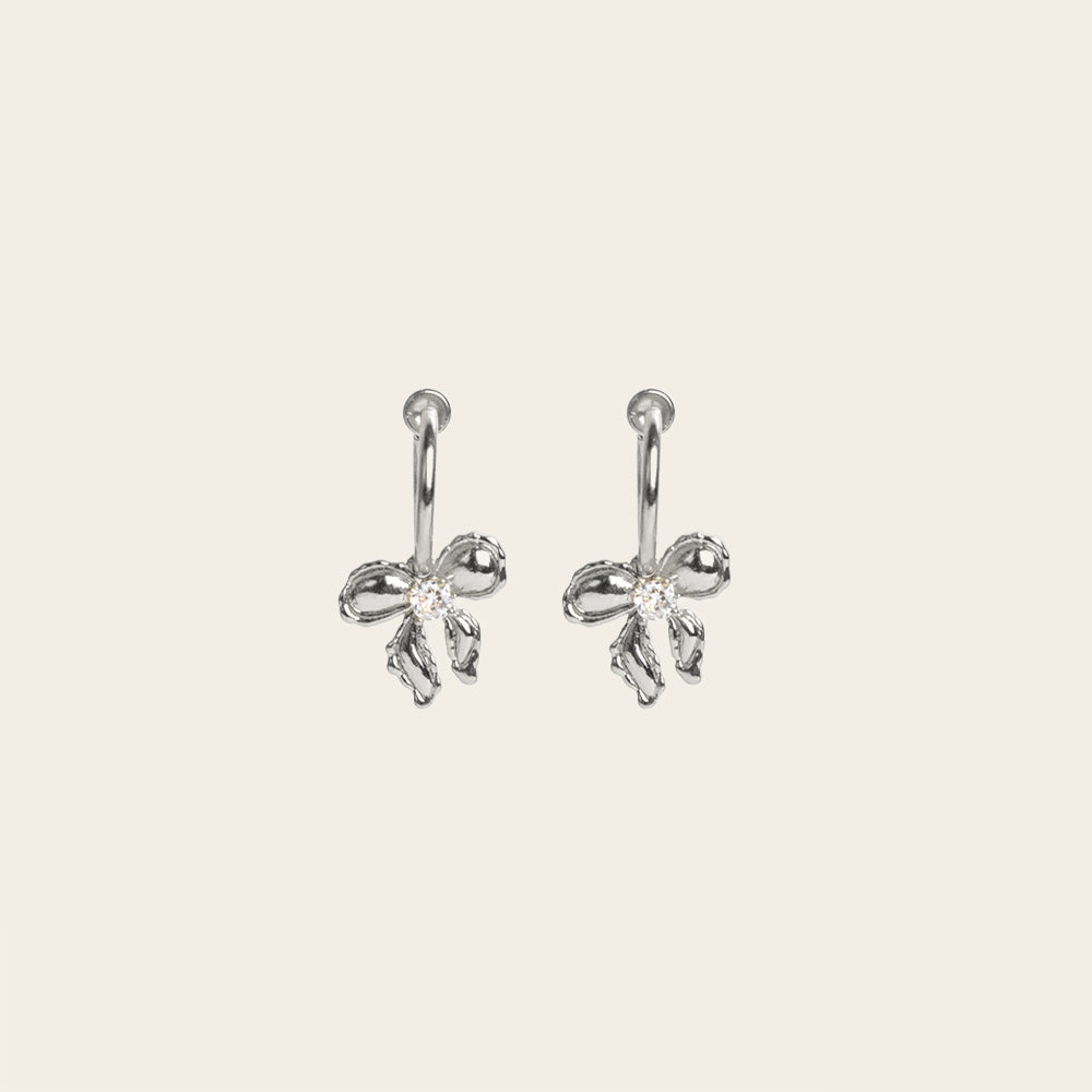 Image of the Ares Clip On Earrings. The sliding spring closure allows for easy adjustment to fit any ear thickness, while the gold tone copper alloy provides a secure hold. Perfect for stretched/healing ears or small/thin earlobes.