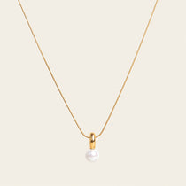 Image of the Ariel Pearl Necklace boasts a Mother of Pearl Pendant for a timeless and enduring beauty. Resilient against tarnishing and water, this necklace exudes confidence and sophistication. Perfect for any occasion.