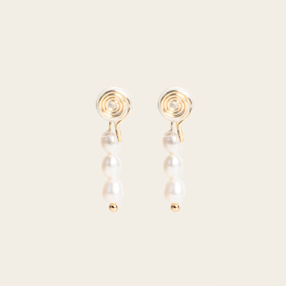 Image of the Audrey Clip On Earrings. These elegant earrings are adjustable for any ear type and provide a secure and comfortable hold for up to 24 hours. Perfect for sensitive or stretched ears, add a touch of sophistication to your daily style.