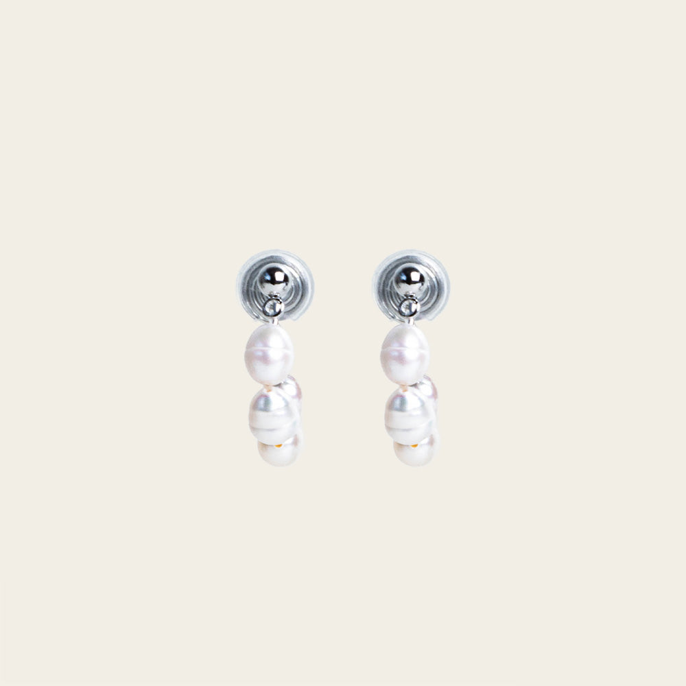 Image of the Blair Clip On Earrings. Our earrings offer a secure 24-hour hold and adjustable fit for all ear types, ideal for sensitive or stretched ears. Elevate your everyday ensemble with a touch of sophistication.