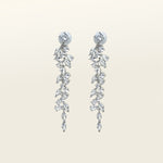 Image of the Cascade Chandelier Clip On Earrings, effortless elegance is yours with these Clip-On Hoop Earrings. Crafted from a luxurious combination of Silver tone copper alloy and Cubic Zirconia, these stylish earrings provide secure closure with their removable rubber padding. Lead/Nickel/Cadmium free, these glamorous earrings are the perfect addition to any ensemble.