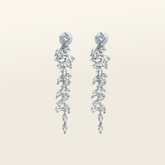 Image of the Cascade Chandelier Clip On Earrings, effortless elegance is yours with these Clip-On Hoop Earrings. Crafted from a luxurious combination of Silver tone copper alloy and Cubic Zirconia, these stylish earrings provide secure closure with their removable rubber padding. Lead/Nickel/Cadmium free, these glamorous earrings are the perfect addition to any ensemble.