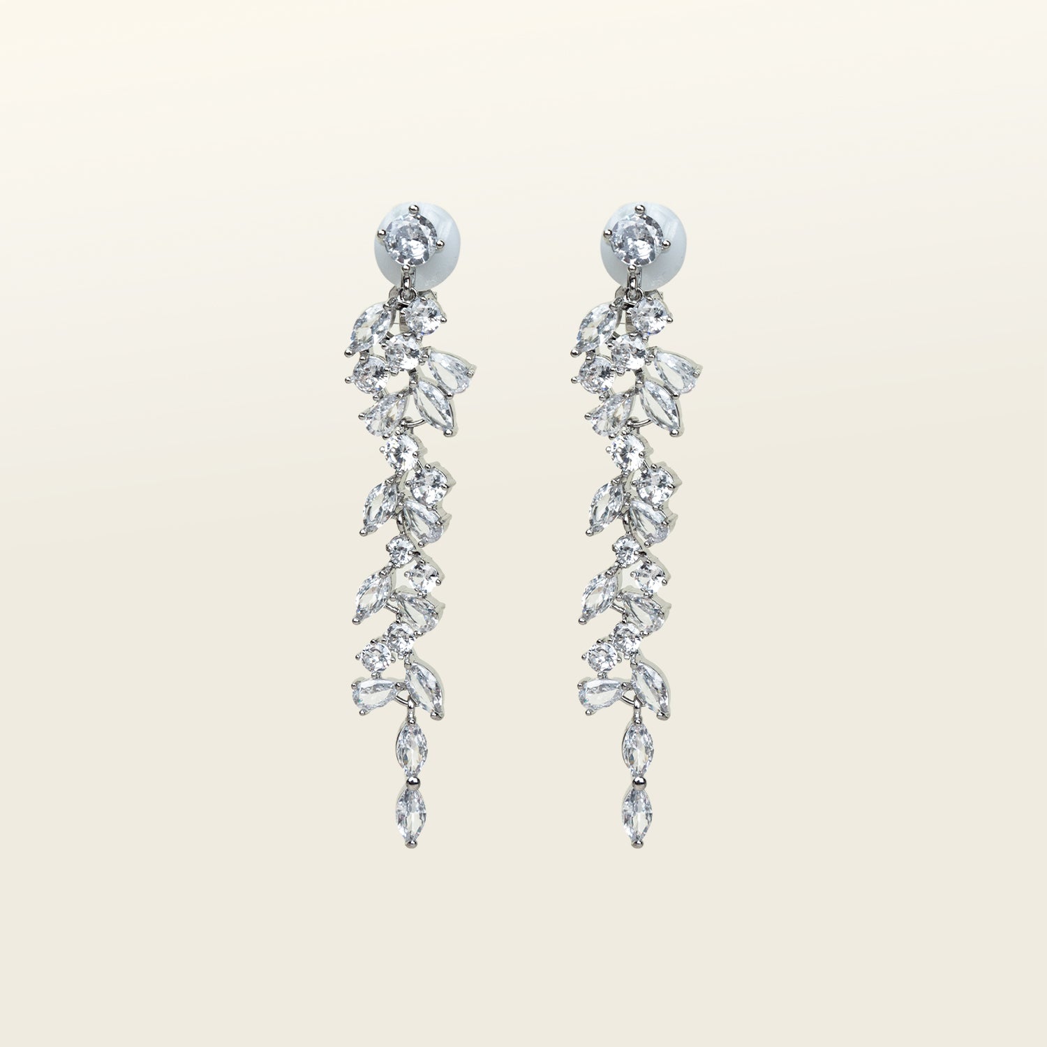 Image of the Cascade Chandelier Clip On Earrings, effortless elegance is yours with these Clip-On Hoop Earrings. Crafted from a luxurious combination of Silver tone copper alloy and Cubic Zirconia, these stylish earrings provide secure closure with their removable rubber padding. Lead/Nickel/Cadmium free, these glamorous earrings are the perfect addition to any ensemble.