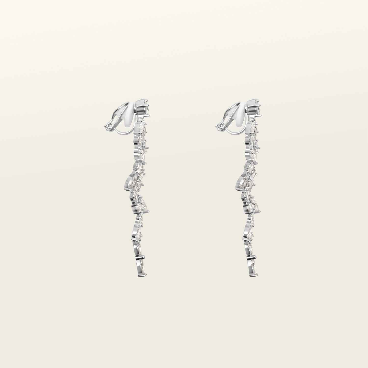 Image of the Cascade Chandelier Clip On Earrings, effortless elegance is yours with these Clip-On Hoop Earrings. Crafted from a luxurious combination of Silver tone copper alloy and Cubic Zirconia, these stylish earrings provide secure closure with their removable rubber padding. Lead/Nickel/Cadmium free, these glamorous earrings are the perfect addition to any ensemble.