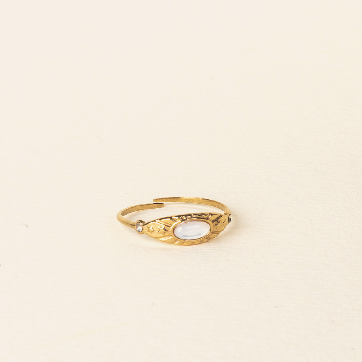 Image of the Celestial Ring, adorned with a luminous Mother of Pearl centerpiece and 18K Gold Plated Stainless Steel. A singularly exquisite piece, sure to never fade nor tarnish, and resilient to water.