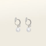 Image of the Claire Pearl Clip On Earrings in Silver present a mosquito coil clip-on closure crafted to accommodate all ear types—from thick/large to sensitive, from small/thin to stretched/healing—ensuring a comfortable fit. Intricately constructed from silver tone copper alloy, Cubic Zirconia, and Simulated Faux Pearl, these earrings add a sophisticated touch to any ensemble.