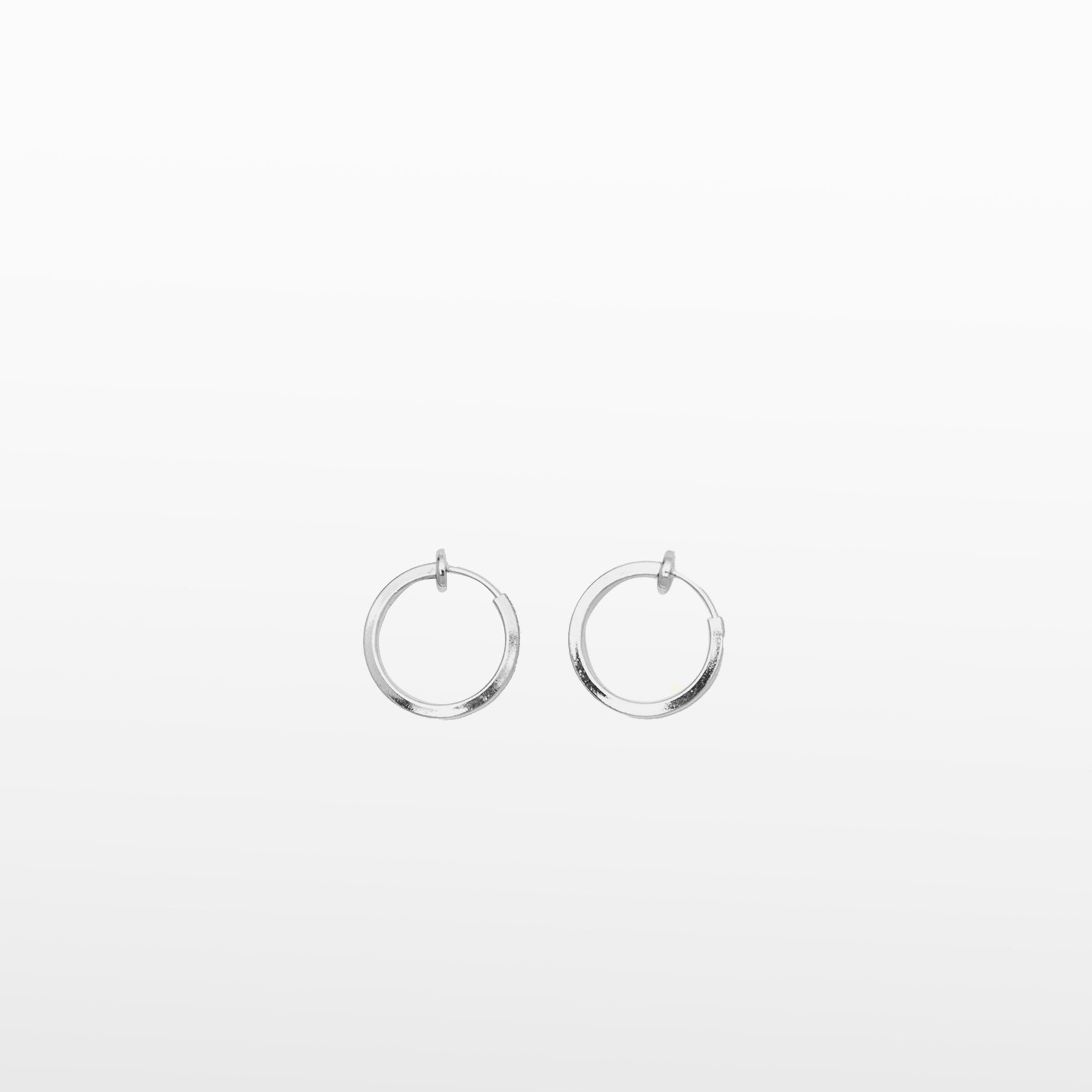 Image of the Classic Hoop Clip On Earrings feature a sliding spring closure that is ideal for small or thin ear lobes. The secure hold enables comfortable wear up to 4 hours, and the design automatically adjusts to the thickness of the ear. Crafted from stainless steel, the earrings come as a single pair.