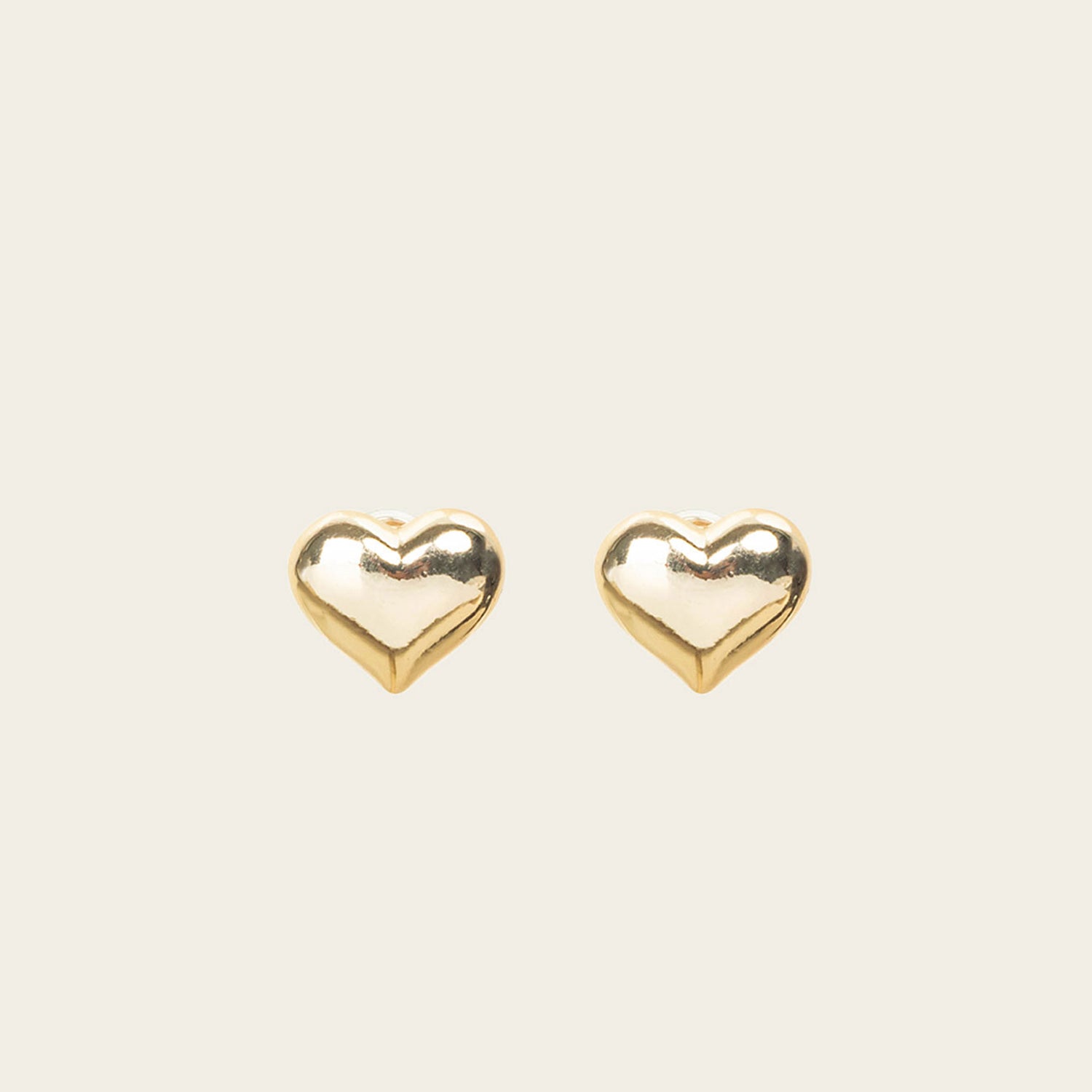 Image of the Coeur Clip On Earrings in Gold offer a medium-strength, adjustable hold via a mosquito coil clip. Ideal for all ear types, these earrings provide a secure yet comfortable fit for up to 24 hours. Crafted with Zinc Alloy and Copper, each purchase contains a single pair.