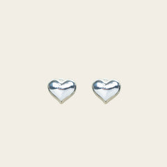 Image of the Coeur Clip On Earrings in Silver offer a medium-strength, adjustable hold via a mosquito coil clip. Ideal for all ear types, these earrings provide a secure yet comfortable fit for up to 24 hours. Crafted with Zinc Alloy and Copper, each purchase contains a single pair.