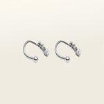 Image of the Constellation Ear Cuff in silver, a captivating and modern accessory that elevates your style. Crafted from copper alloy and available in gold or silver plating, this ear cuff boasts a celestial Constellation shape adorned with three sparkling cubic zirconia stars. Suitable for all genders, this stylish design is guaranteed to add an elegant and celestial touch to any outfit, making it a standout piece in your collection.