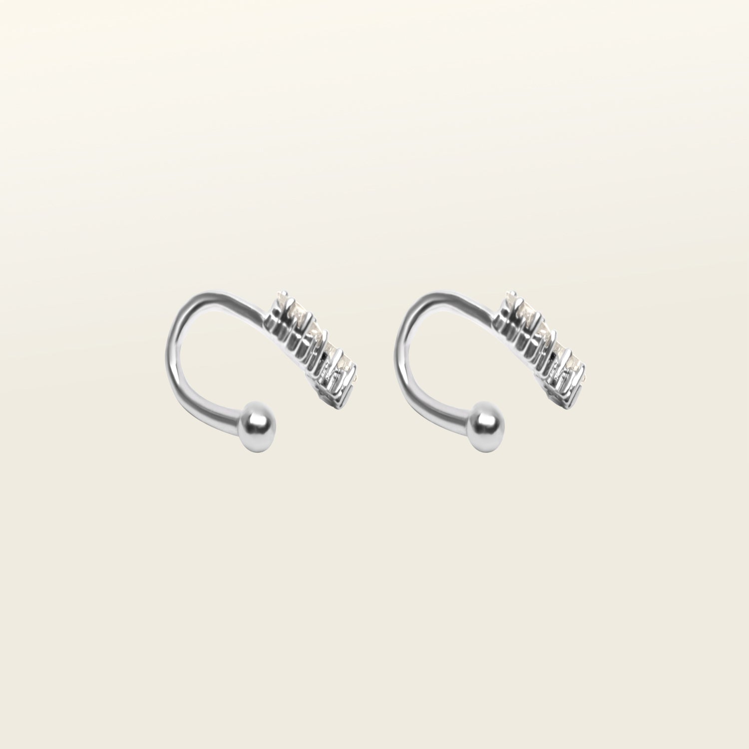 Image of the Constellation Ear Cuff in silver, a captivating and modern accessory that elevates your style. Crafted from copper alloy and available in gold or silver plating, this ear cuff boasts a celestial Constellation shape adorned with three sparkling cubic zirconia stars. Suitable for all genders, this stylish design is guaranteed to add an elegant and celestial touch to any outfit, making it a standout piece in your collection.