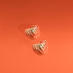 Image of the Croissant Dome Clip On Earrings in Gold are designed to provide a secure fit for all ear types. The rubber padding has a comfortable wear duration of 8-12 hours and is made with a Gold Tone Zinc Alloy. This item includes one pair.