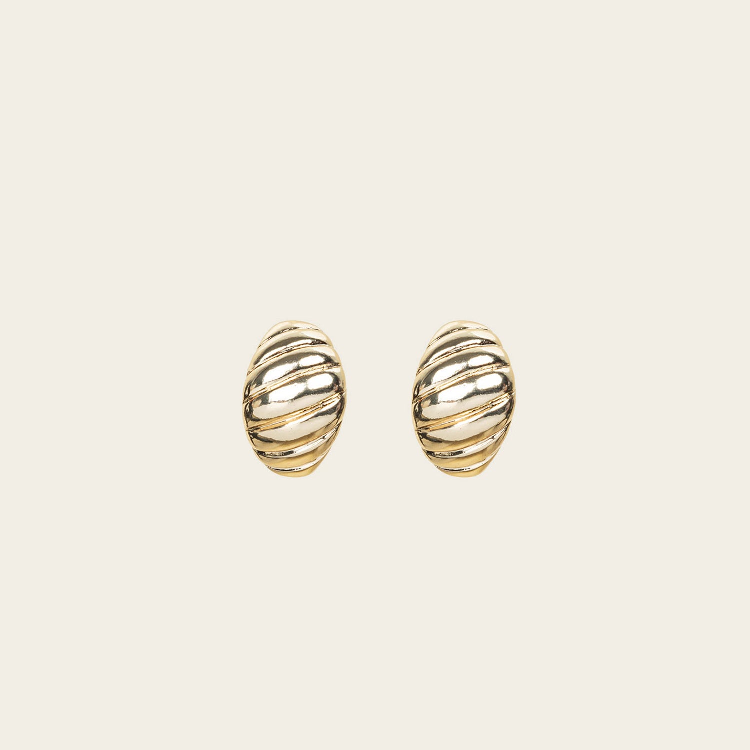 Image of the Croissant Dome Clip On Earrings in Gold are designed to provide a secure fit for all ear types. The rubber padding has a comfortable wear duration of 8-12 hours and is made with a Gold Tone Zinc Alloy. This item includes one pair.
