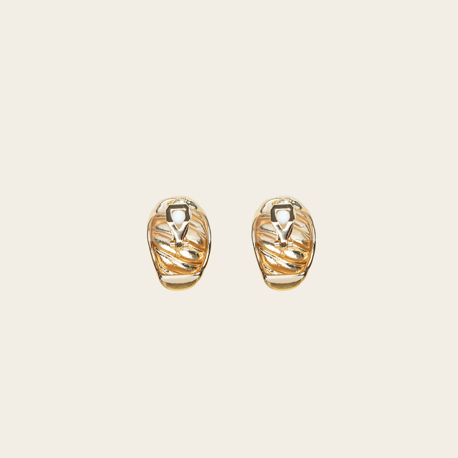 Image of the Croissant Dome Clip On Earrings in Gold are designed to provide a secure fit for all ear types. The rubber padding has a comfortable wear duration of 8-12 hours and is made with a Gold Tone Zinc Alloy. This item includes one pair.