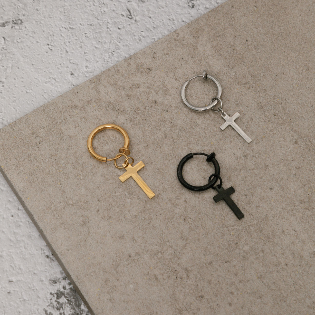 Image of the Cross Clip On Earrings are designed for small to thin earlobes. Their secure closure type sliding spring and adjustable features make them comfortable to wear for up to 4 hours. Made of stainless steel moreover, they are non-tarnish, water resistant, and free of lead, nickel, and cadmium.