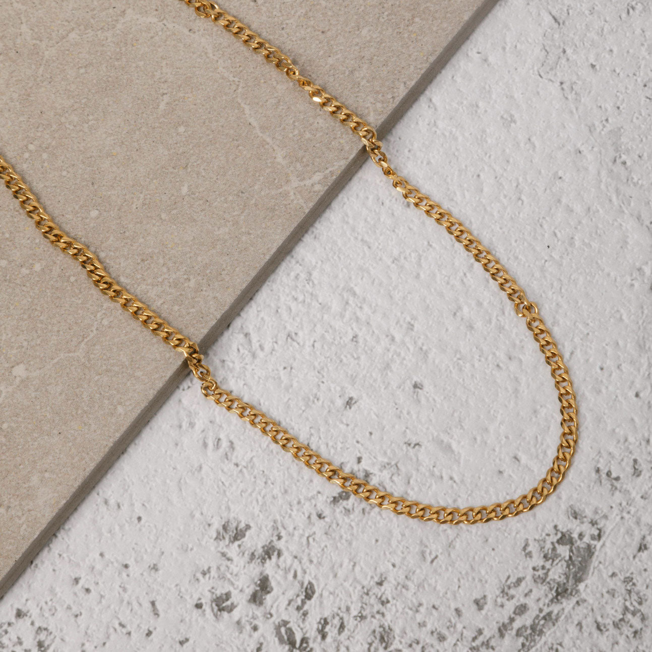 Image of the Cuban Chain in Gold is crafted from 18K Gold Plated material and is non-tarnish, water-resistant, and designed to be hypoallergenic.