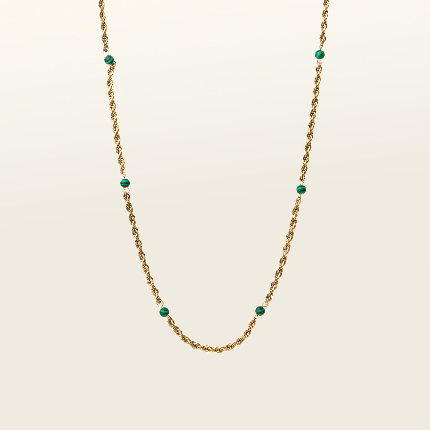 Image of the Cyrus Chain Necklace features adjustable sizing and is constructed with 18K gold-plated stainless steel and natural malachite stone for a durable, non-tarnish, and waterproof design. Please note that this item is one necklace.