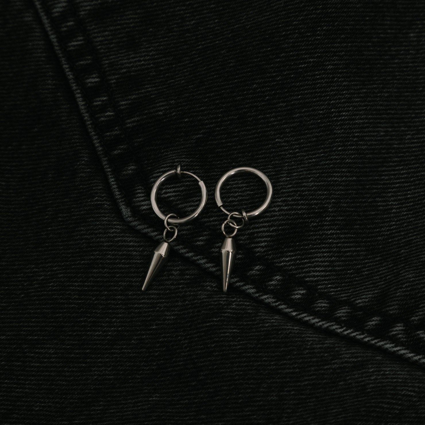 Image of the Dagger Clip On Earrings feature a sliding spring closure type, making them best suited to those with small or thin ears. The earrings are capable of providing a secure hold for an average of 2-4 hours, and have the ability to adjust automatically to the thickness of your earlobes. Crafted from stainless steel, each pair includes a single set of earrings.