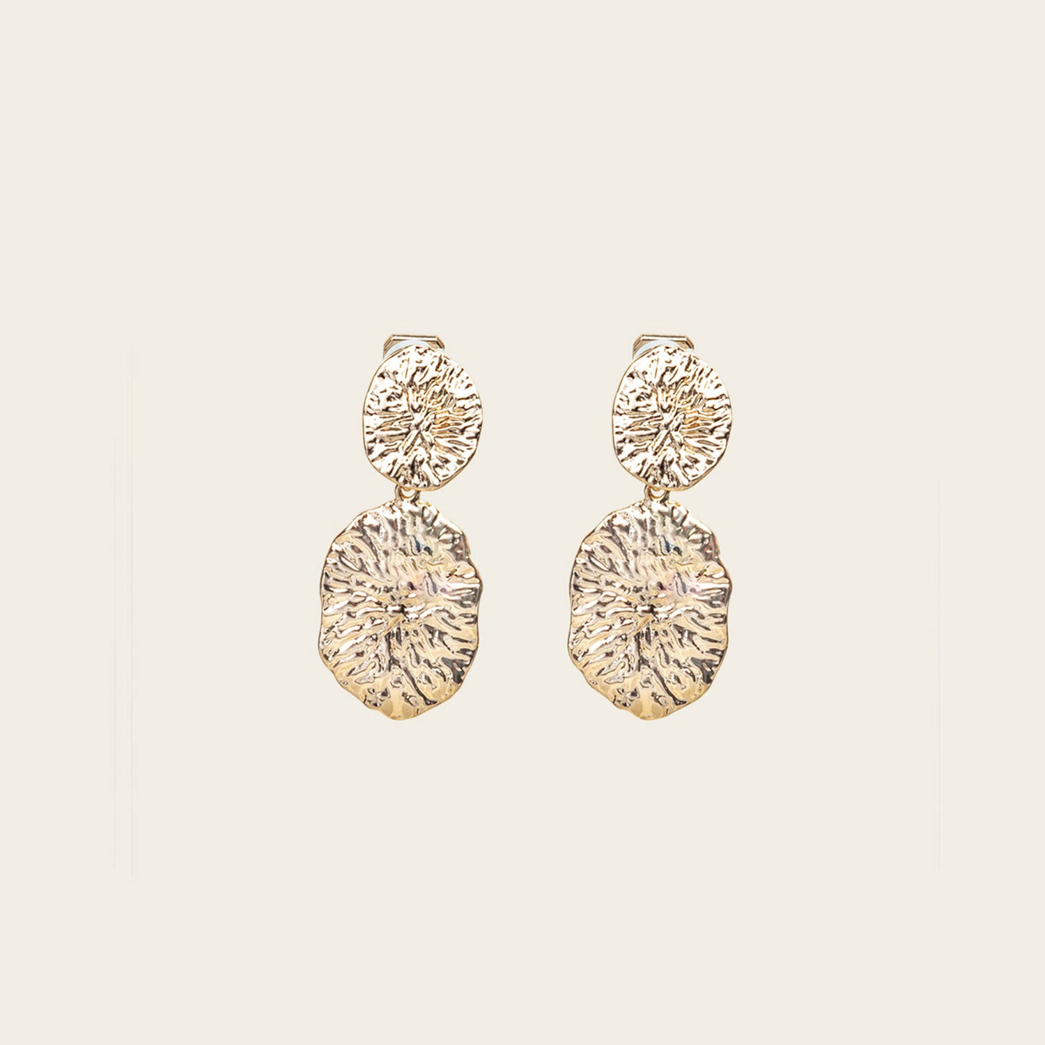 Image of the Daiquiri Drop Clip On Earrings in Gold feature a secure, padded clip-on closure ideal for all ear types, offering up to 12 hours of comfortable wear. Crafted from Zinc and Copper alloy, these earrings come as a single pair with removable rubber padding.