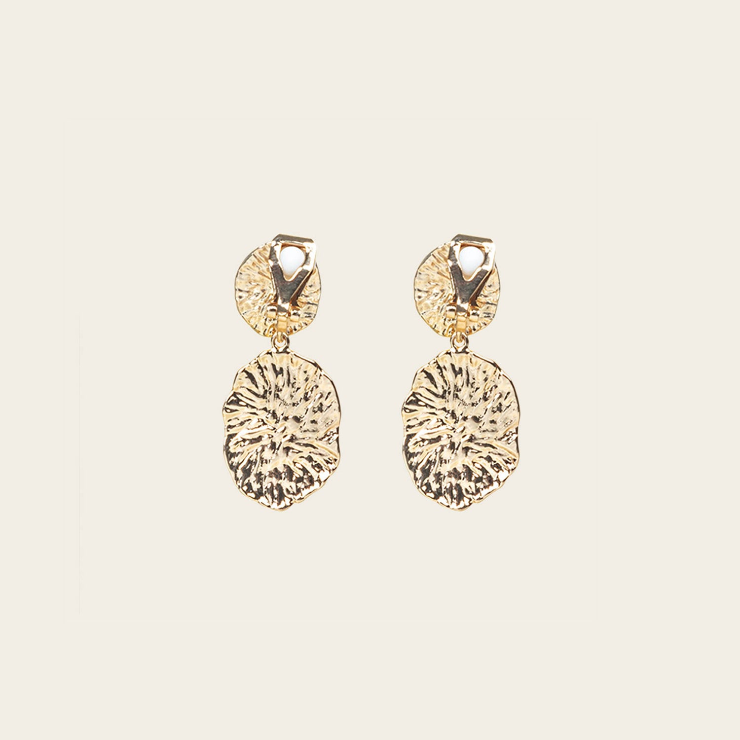 Image of the Daiquiri Drop Clip On Earrings in Gold feature a secure, padded clip-on closure ideal for all ear types, offering up to 12 hours of comfortable wear. Crafted from Zinc and Copper alloy, these earrings come as a single pair with removable rubber padding.