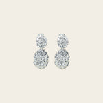 Image of the Daiquiri Drop Clip On Earrings in Silver feature a secure, padded clip-on closure ideal for all ear types, offering up to 12 hours of comfortable wear. Crafted from Zinc and Copper alloy, these earrings come as a single pair with removable rubber padding.