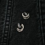 Image of the Double Hoop Pave Clip On Earrings in Silver feature a secure mosquito coil clip-on closure for most ear types. With an easy adjustable design, these earrings can be worn for 24 hours with a comfortable medium hold. Made of sterling silver plated copper with a Cubic Zirconia detail, these earrings are a great addition to any wardrobe.