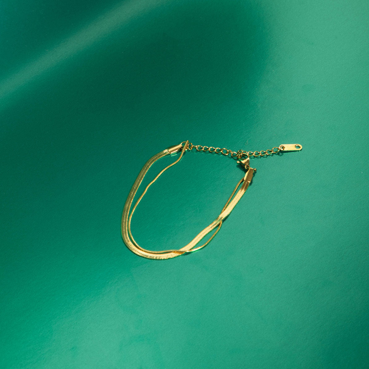 Image of the Double Layered Bracelet is crafted from 14K gold plated stainless steel for outstanding durability and a non-tarnish, water-resistant, allergy-free and antioxidant finish. Plus, its adjustable design ensures a perfect fit for any wrist.