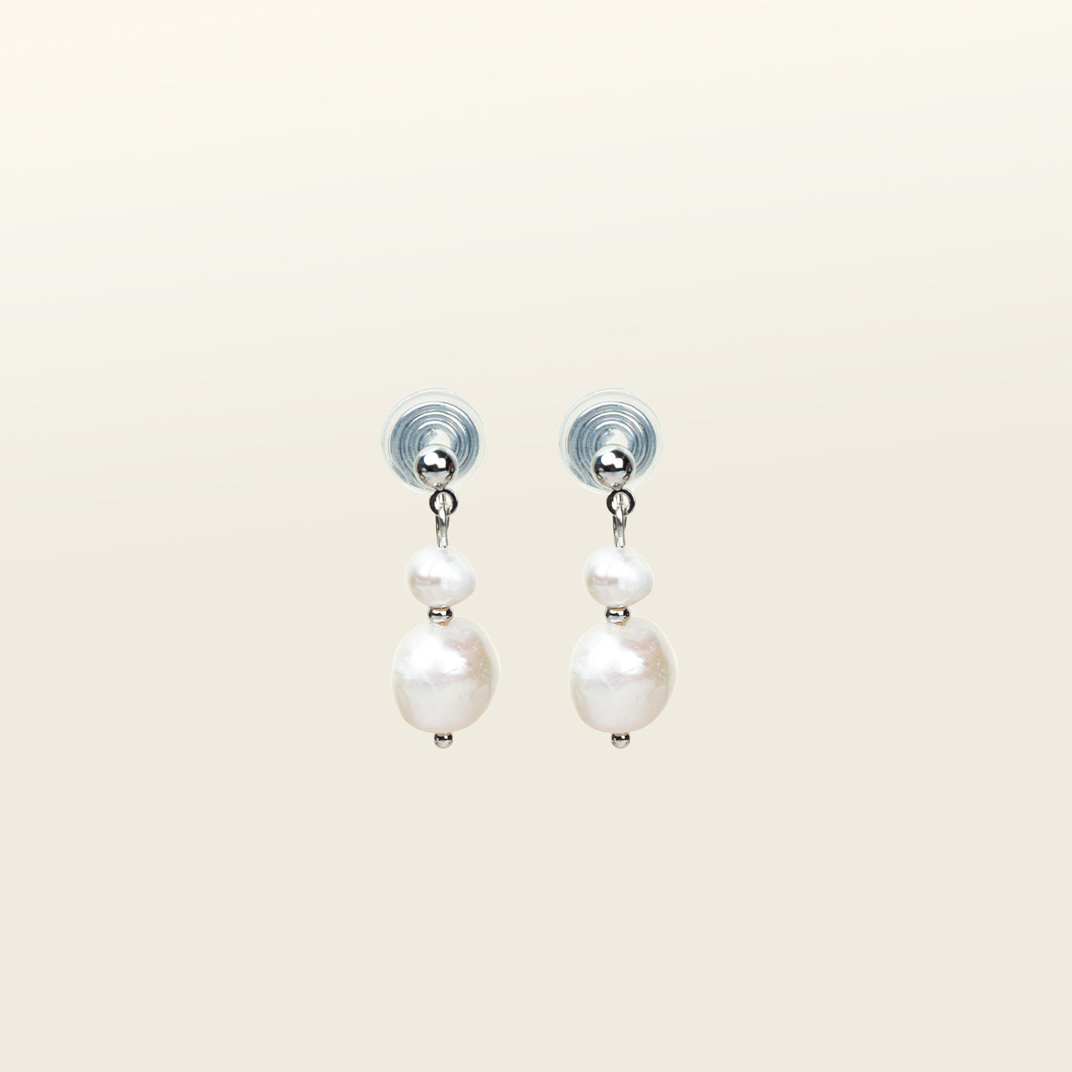 Image of the Silver Plated Brass Duo Pearl Clip-On Earrings features a mosquito coil clip-on design, making it ideal for all ear types including those with thick/large, sensitive, small/thin, and stretched/healing ears. These earrings comfortably allow for up to 24 hours of wear and have a medium secure hold with adjustable padding. The freshwater pearls used in these earrings may vary slightly in size and colour.